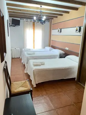 Cama o camas de una habitación en Hostal El Descanso Del Emperador