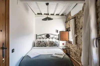 Cama o camas de una habitación en Apartamentos Rurales 