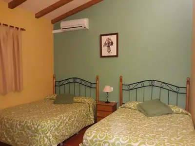 Cama o camas de una habitación en CAMPING-BUNGALOWS-CABAÑAS LA VERA