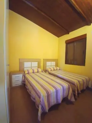 Cama o camas de una habitación en CAMPING-BUNGALOWS-CABAÑAS LA VERA