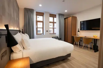 Cama o camas de una habitación en Prisma Suites