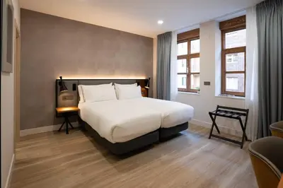 Cama o camas de una habitación en Prisma Suites