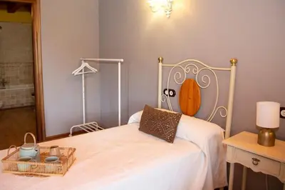 Cama o camas de una habitación en Casa rural María Saula