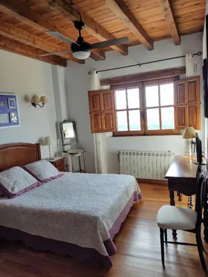 Cama o camas de una habitación en Casa Rural El Regajo Valle del Jerte