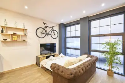 Una televisión o centro de entretenimiento en Loft diseño el taller del abuelo con parking