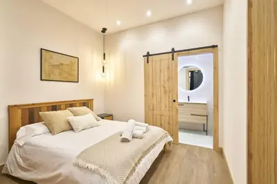 Cama o camas de una habitación en Loft diseño el taller del abuelo con parking