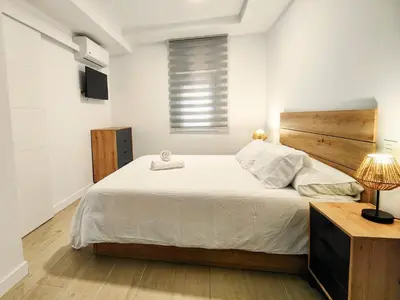 Cama o camas de una habitación en +Homes | El Andén de Garrido (sin ascensor)