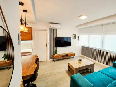 Una televisión o centro de entretenimiento en +Homes | El Andén de Garrido (sin ascensor)