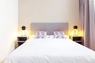 Cama o camas de una habitación en Acanto Apartamentos