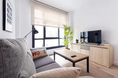 Una televisión o centro de entretenimiento en Acanto Apartamentos