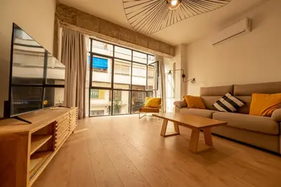 Una televisión o centro de entretenimiento en Apartamento La Dormilona