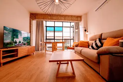 Una televisión o centro de entretenimiento en Apartamento La Dormilona