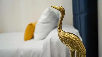 Cama o camas de una habitación en Apartamentos Puente Romano Suites Parking Gratis