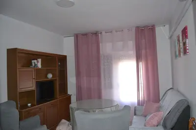 Una televisión o centro de entretenimiento en Apartamento Las Fuentes