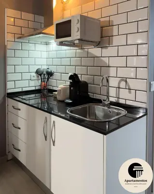 Una cocina o zona de cocina en Apartamentos Basílica Santa Eulalia PARKING GRATIS