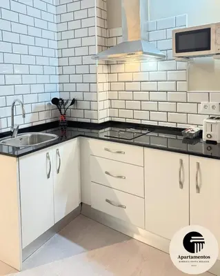 Una cocina o zona de cocina en Apartamentos Basílica Santa Eulalia PARKING GRATIS
