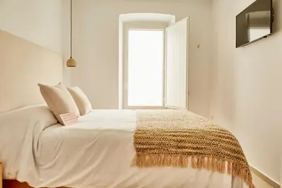 Cama o camas de una habitación en LUPERCAS