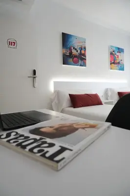 Cama o camas de una habitación en Hotel Gabriel y Galán