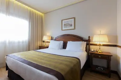 Cama o camas de una habitación en Dorma Reina Isabel