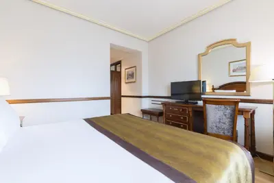 Cama o camas de una habitación en Dorma Reina Isabel