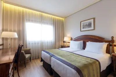 Cama o camas de una habitación en Dorma Reina Isabel