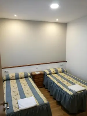 Cama o camas de una habitación en Hostal Mirobriga