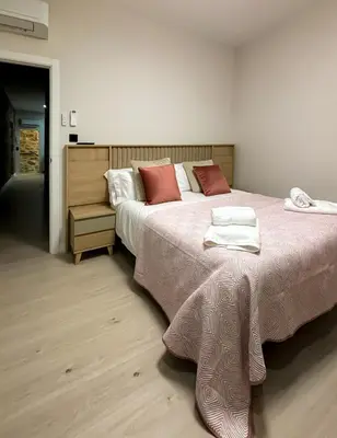 Cama o camas de una habitación en El Reloj De La Villa