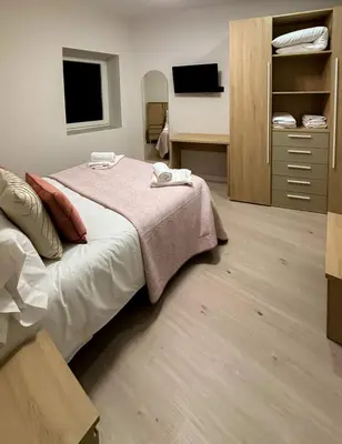 Cama o camas de una habitación en El Reloj De La Villa