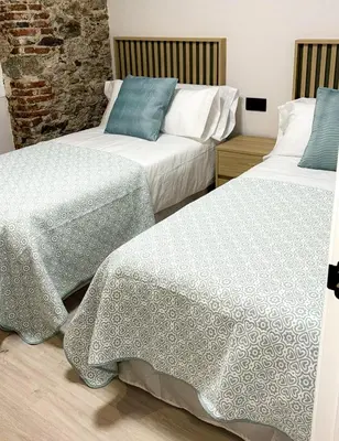 Cama o camas de una habitación en El Reloj De La Villa