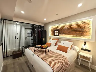 Cama o camas de una habitación en La Parada del Rey - Luxury Suites