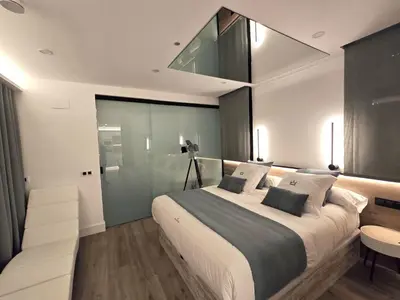 Cama o camas de una habitación en La Parada del Rey - Luxury Suites