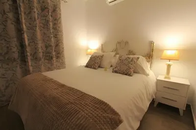 Cama o camas de una habitación en Apartamentos La Vera de Gredos
