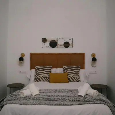 Cama o camas de una habitación en VETURIA APARTAMENTOS TURISTICOS