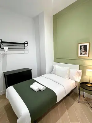 Cama o camas de una habitación en Apartamentos Élite - Art Collection - Leonardo