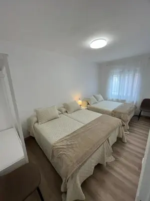 Cama o camas de una habitación en La Alameda