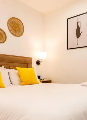 Cama o camas de una habitación en Apartamentos Cibeles Centro Histórico, Nuevo Establecimiento