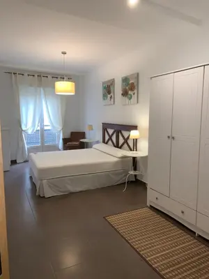 Cama o camas de una habitación en APARTAMENTO JALAMA 1B