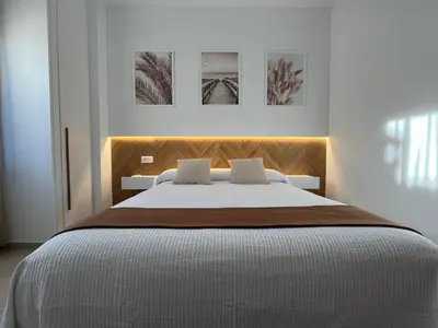 Cama o camas de una habitación en Hostal Parador de los Llanos