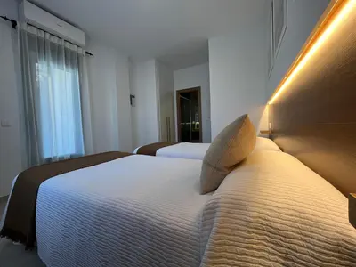 Cama o camas de una habitación en Hostal Parador de los Llanos