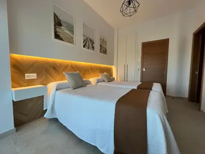 Cama o camas de una habitación en Hostal Parador de los Llanos