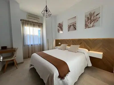 Cama o camas de una habitación en Hostal Parador de los Llanos