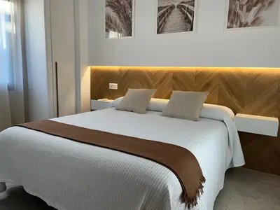 Cama o camas de una habitación en Hostal Parador de los Llanos