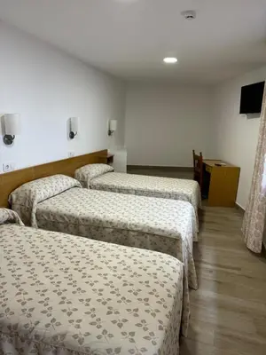Cama o camas de una habitación en Hostal cazalegas