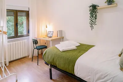 Cama o camas de una habitación en Centro, Hospital y Campus Universitario a 5 minutos - Camas de primera - Lavadora - SmartTV - Wifi 1 GB - Teletrabajo