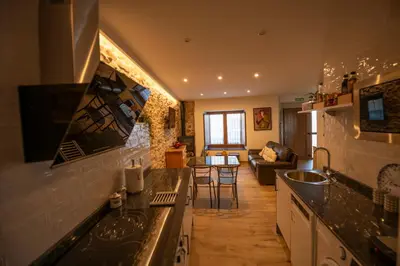 Una televisión o centro de entretenimiento en Casa Rural El Capricho de Sandra
