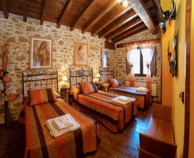 Cama o camas de una habitación en CASA RURAL SANDRA