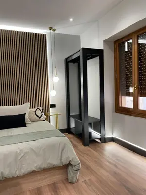 Cama o camas de una habitación en Plaza Mayor de Salamanca Apartamentos para grupos