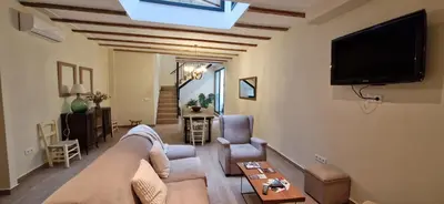 Una televisión o centro de entretenimiento en Casa Rural La Viña