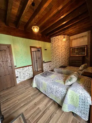 Cama o camas de una habitación en CASA RURAL EL TORREON