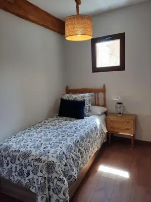 Cama o camas de una habitación en La casa de los Abuelos